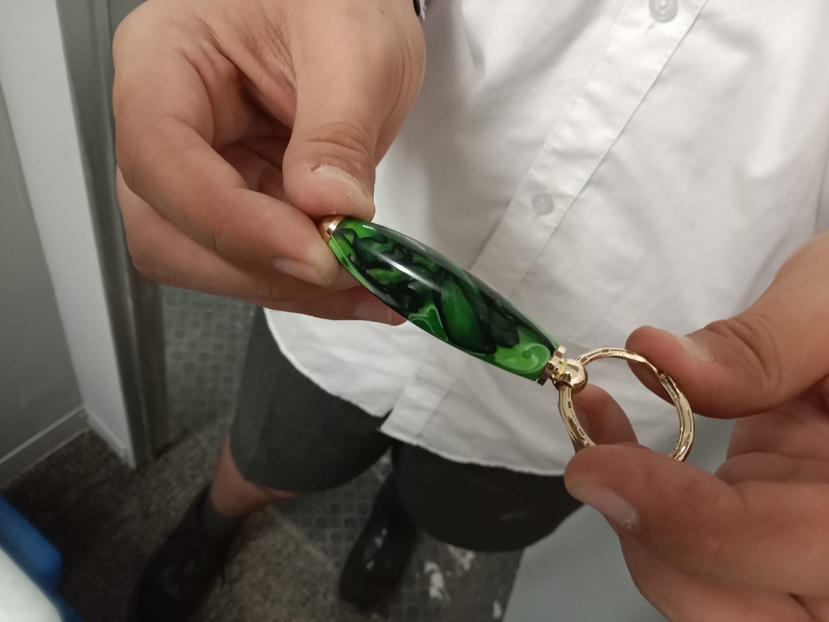 mr woodturner nuwe hoop skool gallery green and gold acrylic keychain created by student